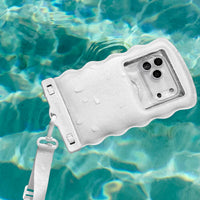The Ivory Twinkle Wavy Waterproof Floating Phone Pouch, with a white strap, keeps your smartphone safe as it floats on blue pool water. Water droplets bead on the clear case for reliable waterproof protection.